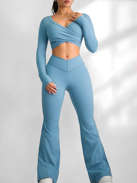 Woman wearing a blue athletic outfit on a light gray background