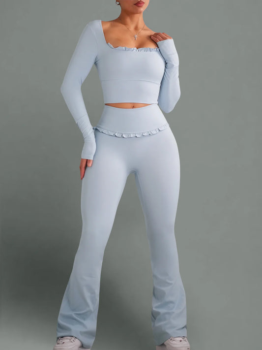 Light blue athletic outfit worn by a person on a gray background