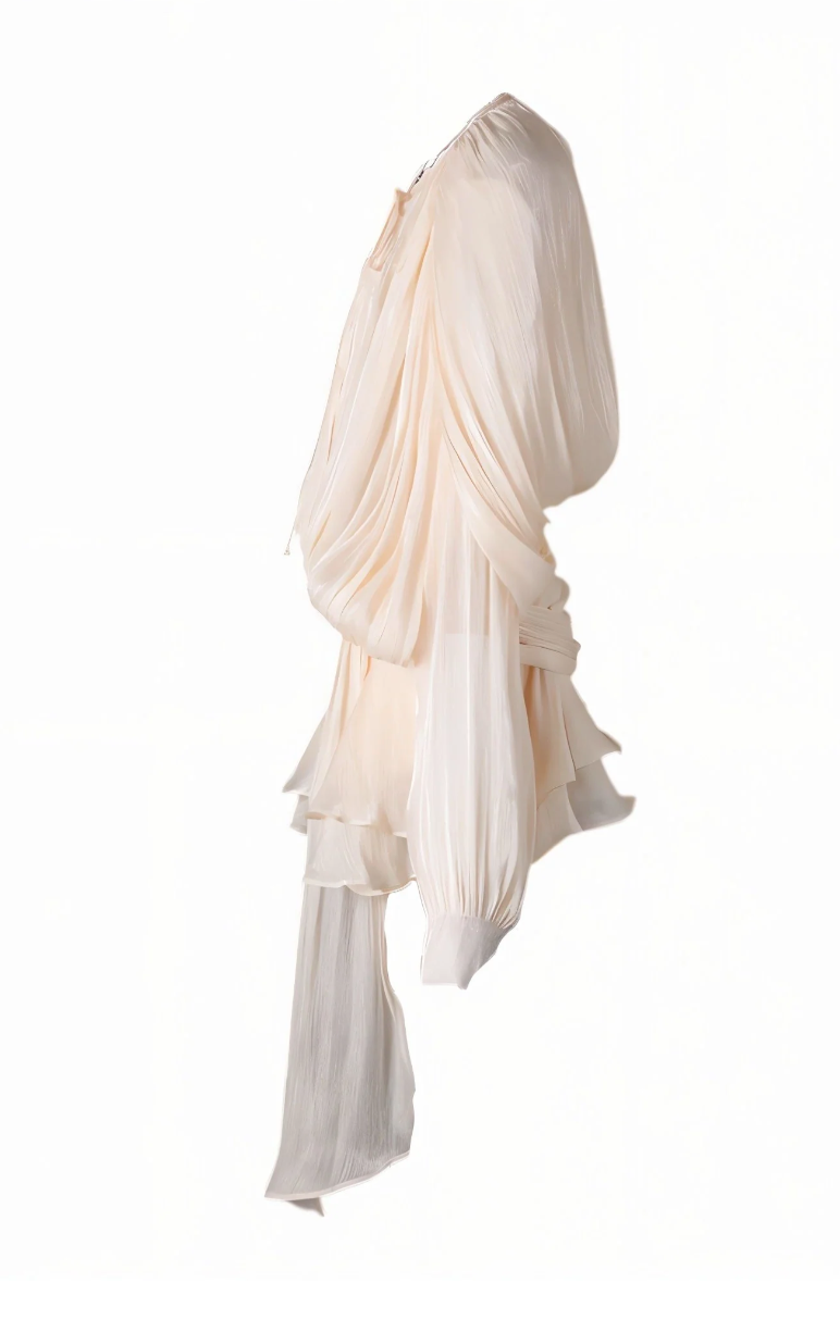 Beige apricot ruffled dress with tie detail on a white background