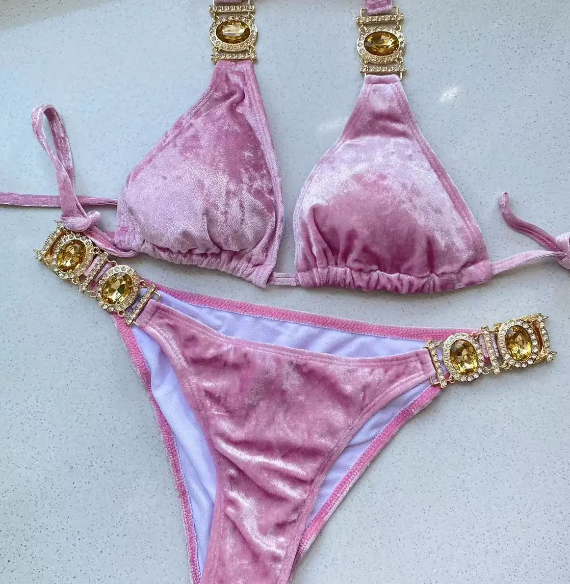 Close-up of the Italia Couture 'Arielle' Jewellery Bikini, showcasing intricate gem details and a chic cherry pink velvet finish.