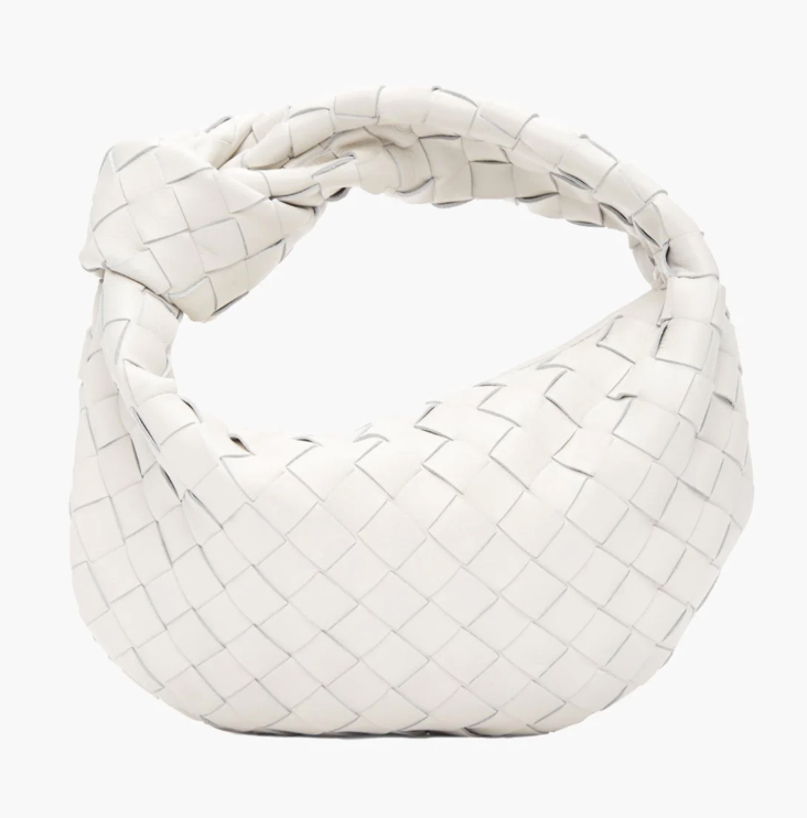 White woven handbag on a white background