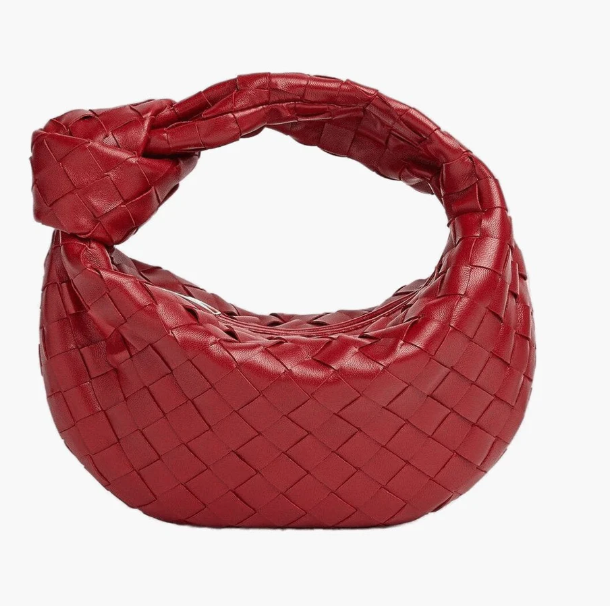 Red woven handbag on a white background