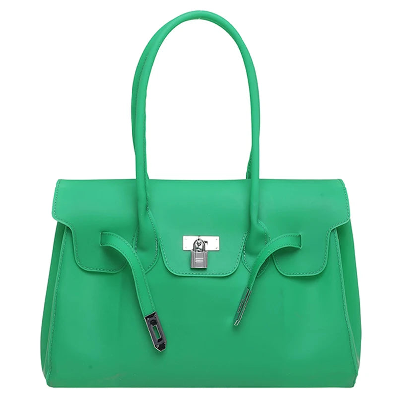 Green Jelly Firkin Bag with a silver clasp on a white background