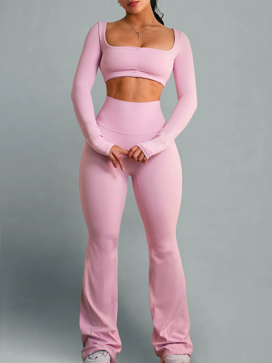 Person wearing a pink athletic outfit on a gray background