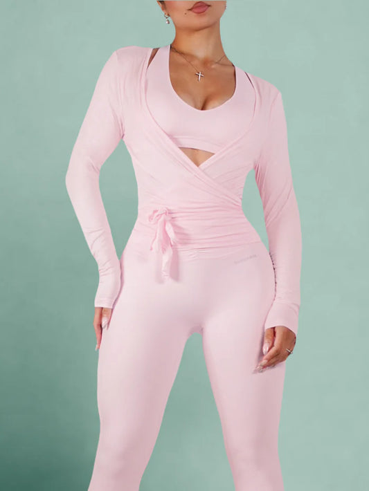 Pink jumpsuit worn by a person on a green background