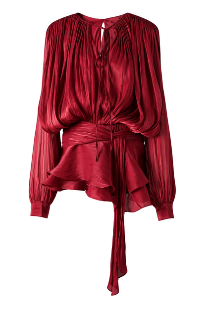 Red ruffled dress with a tie detail on a white background