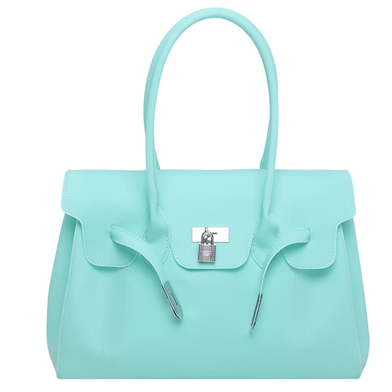 Light Blue Jelly Firkin Bag with a silver lock on a white background