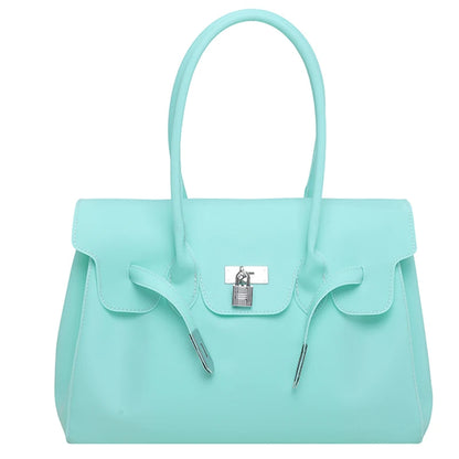 Light Blue Jelly Firkin Bag with a silver lock on a white background