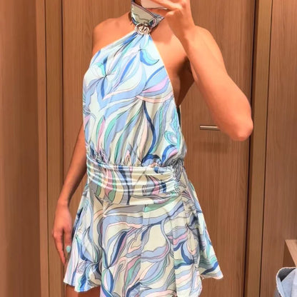 Woman wearing a colorful patterned dress against a wooden background