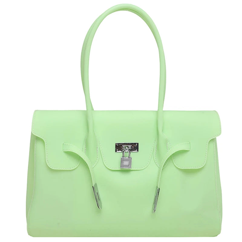 Light green Jelly Firkin Bag with a silver lock on a white background