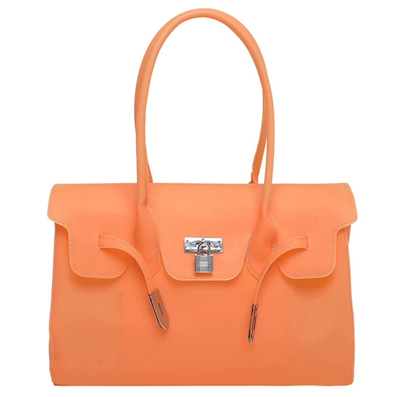 Orange Jelly Firkin Bag with a silver lock on a white background