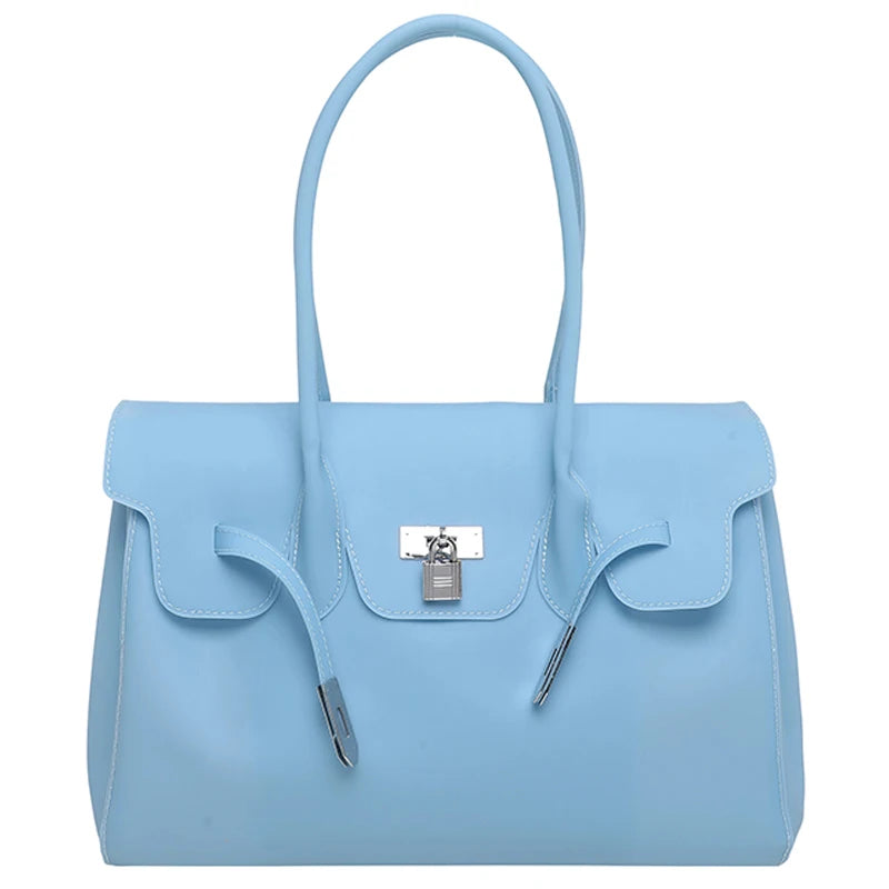 Light blue Jelly Firkin Bag with a silver clasp on a white background
