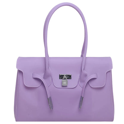 Purple Jelly Firkin Bag with a silver lock on a white background